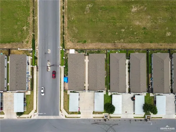 an aerial view of residential house with parking