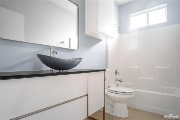 a bathroom with a toilet and a sink