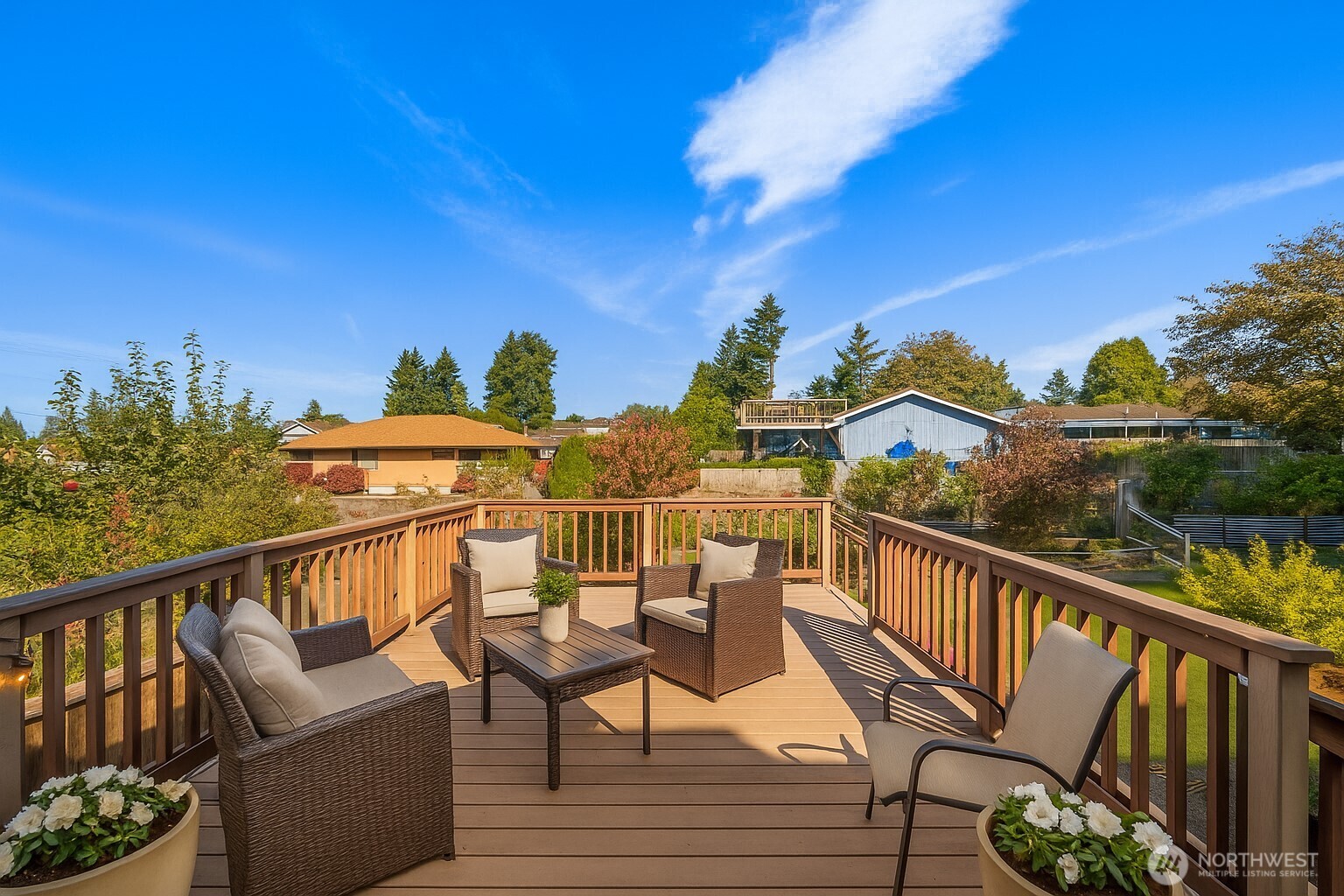 1212 South 230th Street Des Moines, WA 98198 - Photo 22 of 32 a view of a balcony with wooden chairs