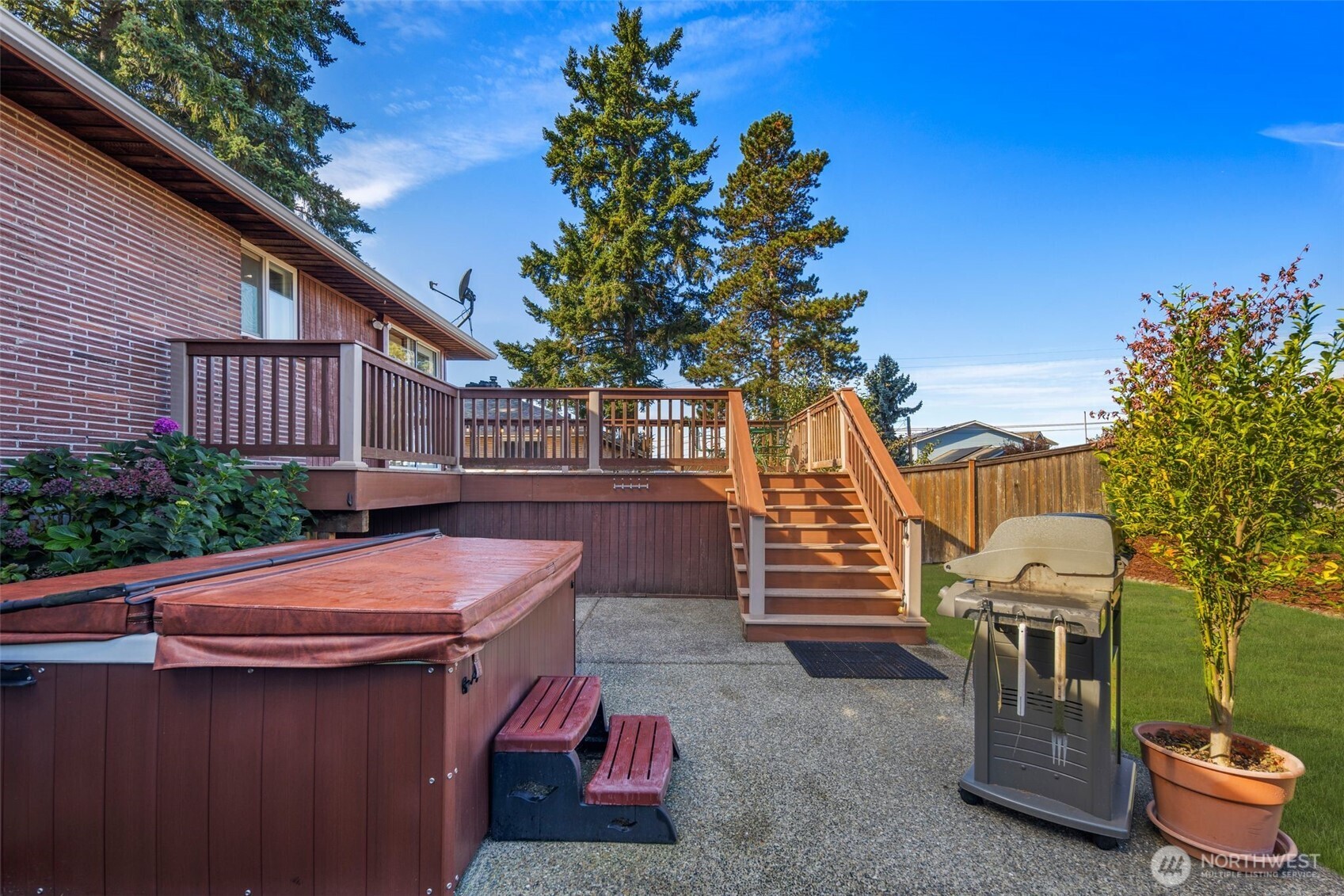 1212 South 230th Street Des Moines, WA 98198 - Photo 24 of 32 a view of a patio with table and chairs and potted plants