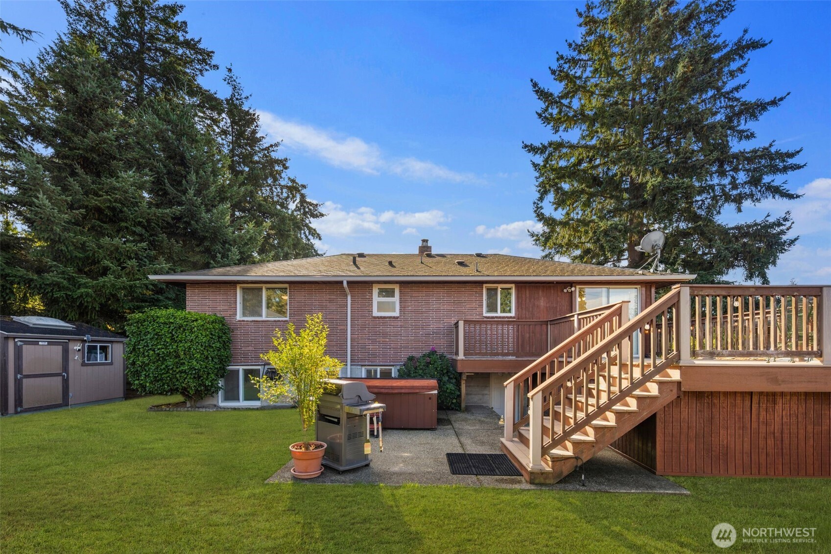 1212 South 230th Street Des Moines, WA 98198 - Photo 27 of 32 a view of a chair and table in the backyard