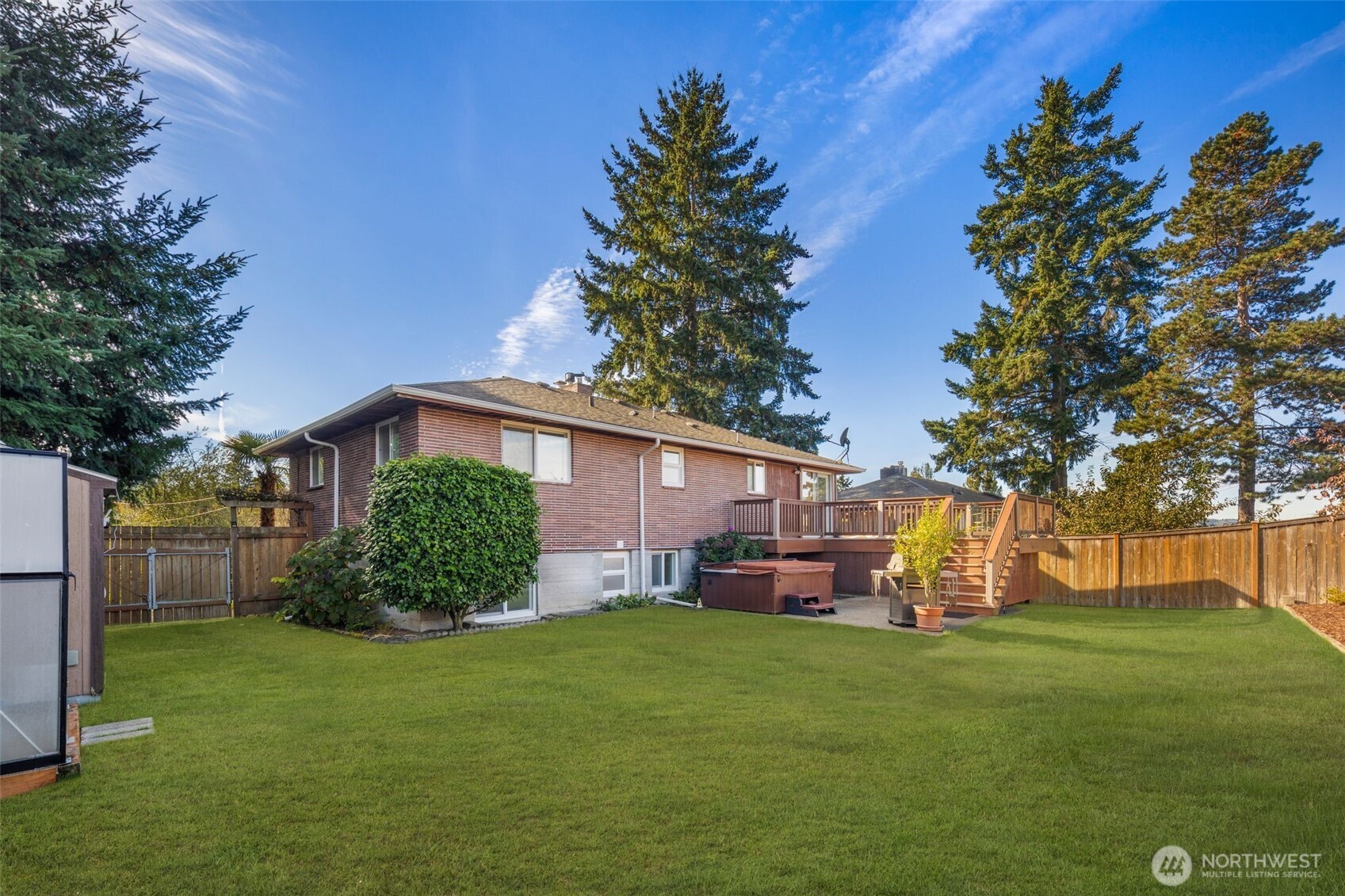 1212 South 230th Street Des Moines, WA 98198 - Photo 29 of 32 a front view of a house with garden