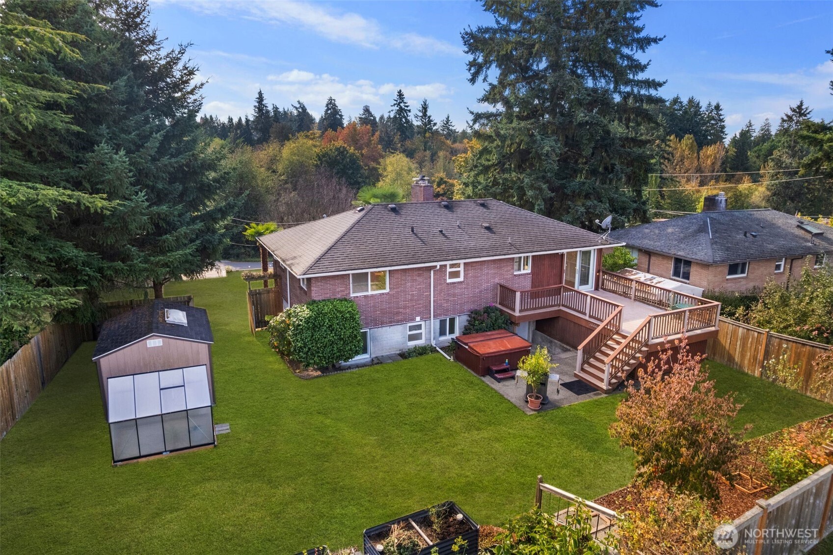 1212 South 230th Street Des Moines, WA 98198 - Photo 32 of 32 an aerial view of a house with garden space and street view