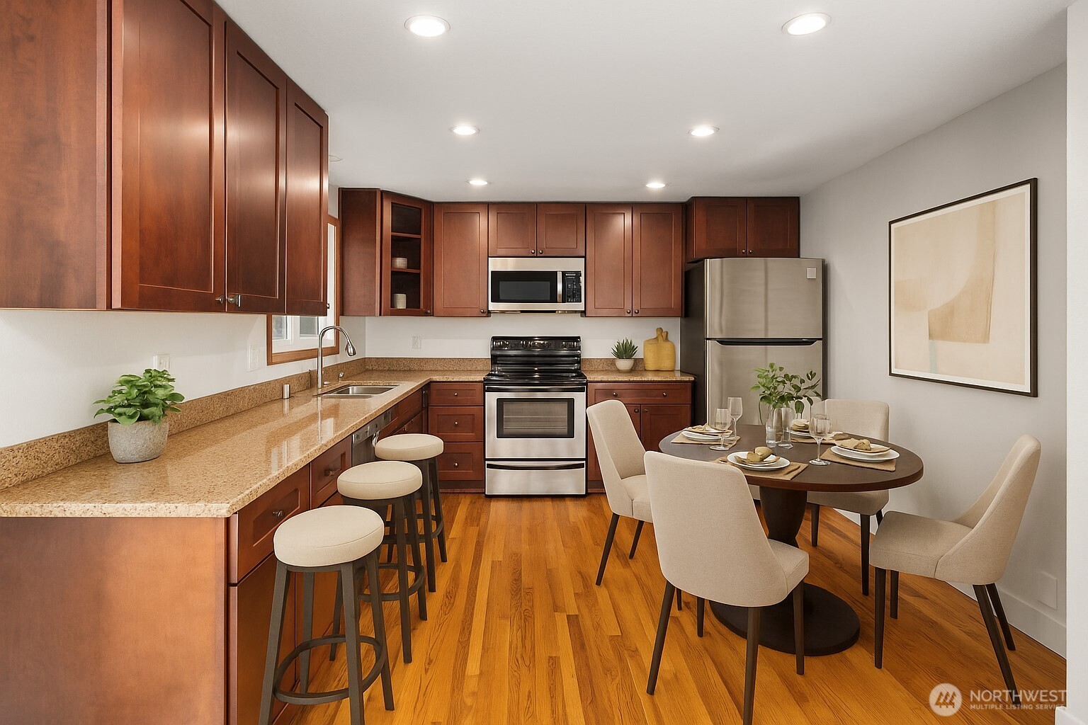 1212 South 230th Street Des Moines, WA 98198 - Photo 7 of 32 a kitchen with stainless steel appliances kitchen island granite countertop a table and chairs