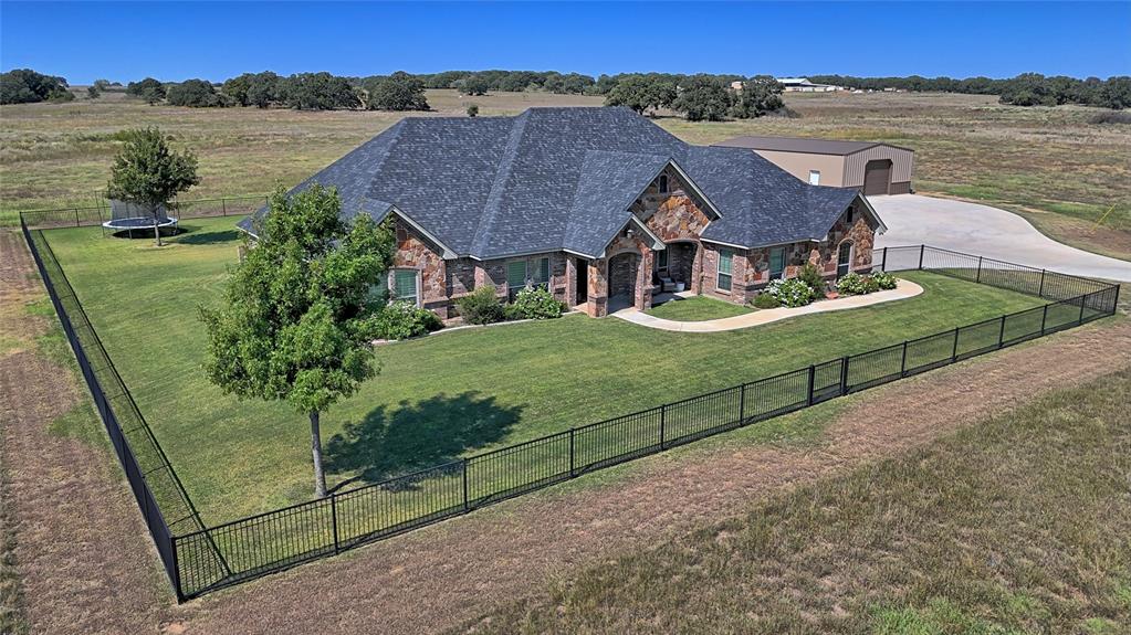 1150 Lone Star Road Bowie, TX 76230 - Photo 2 of 38 an aerial view of residential houses with outdoor space and city view