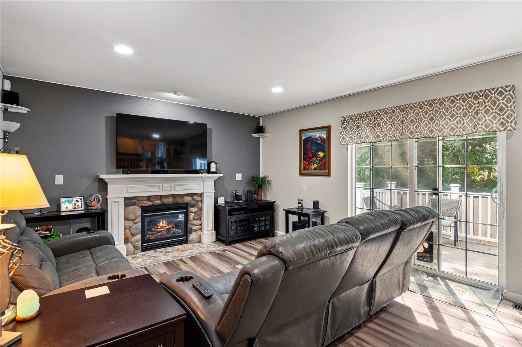 2502 97th Place Southeast Everett, WA 98208 - Photo 14 of 29 a living room with furniture a flat screen tv and a fireplace
