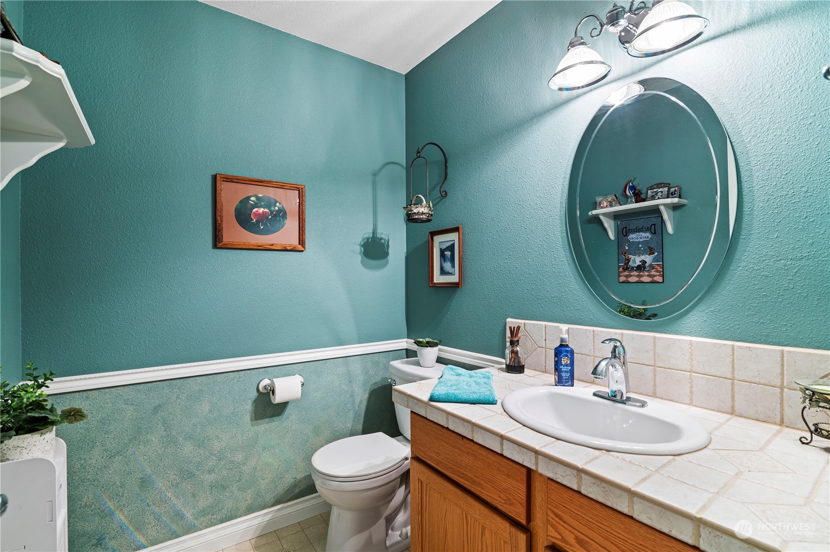 2502 97th Place Southeast Everett, WA 98208 - Photo 16 of 29 a bathroom with a toilet a sink and mirror