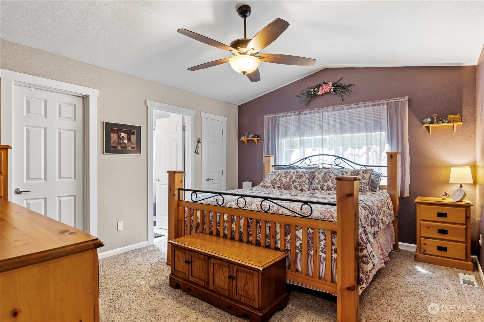 2502 97th Place Southeast Everett, WA 98208 - Photo 17 of 29 a bedroom with a bed and a chandelier