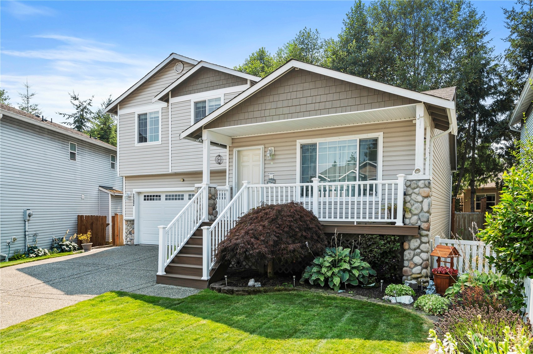 2502 97th Place Southeast Everett, WA 98208 - Photo 2 of 29 a view of a house with a yard and plants