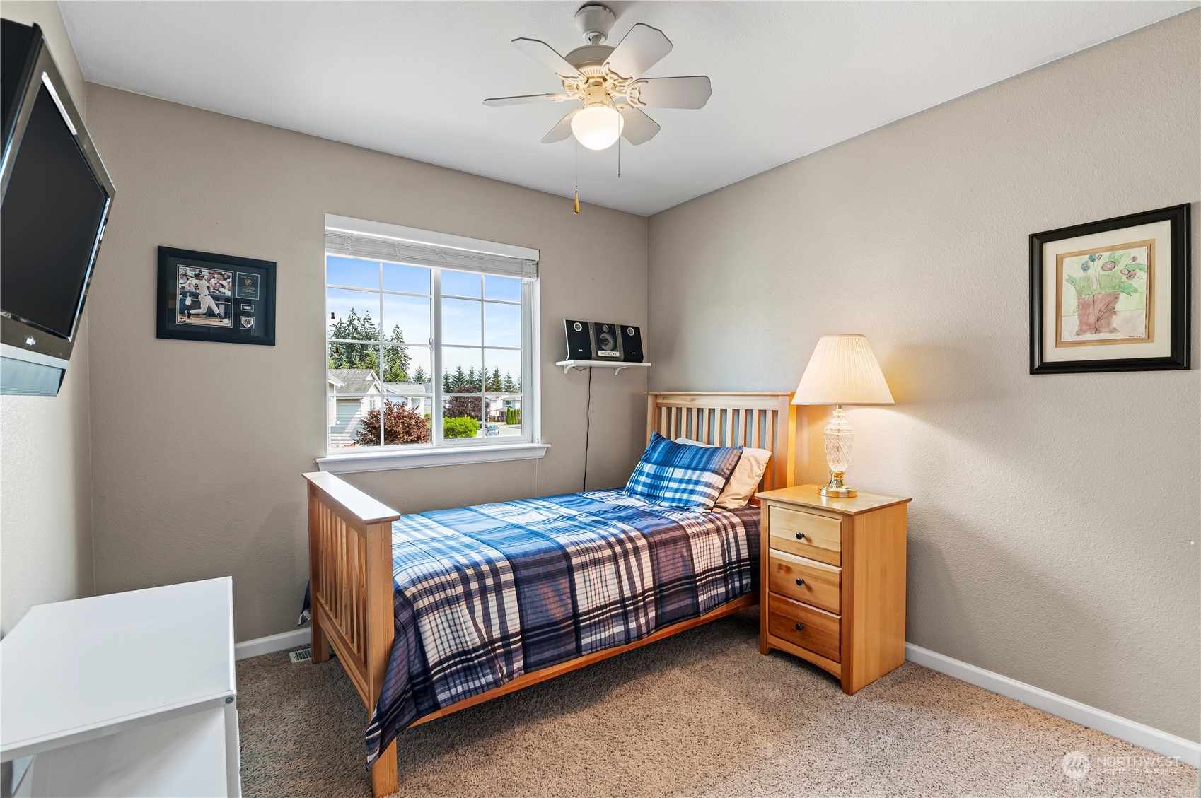 2502 97th Place Southeast Everett, WA 98208 - Photo 22 of 29 a bedroom with a bed and a chandelier