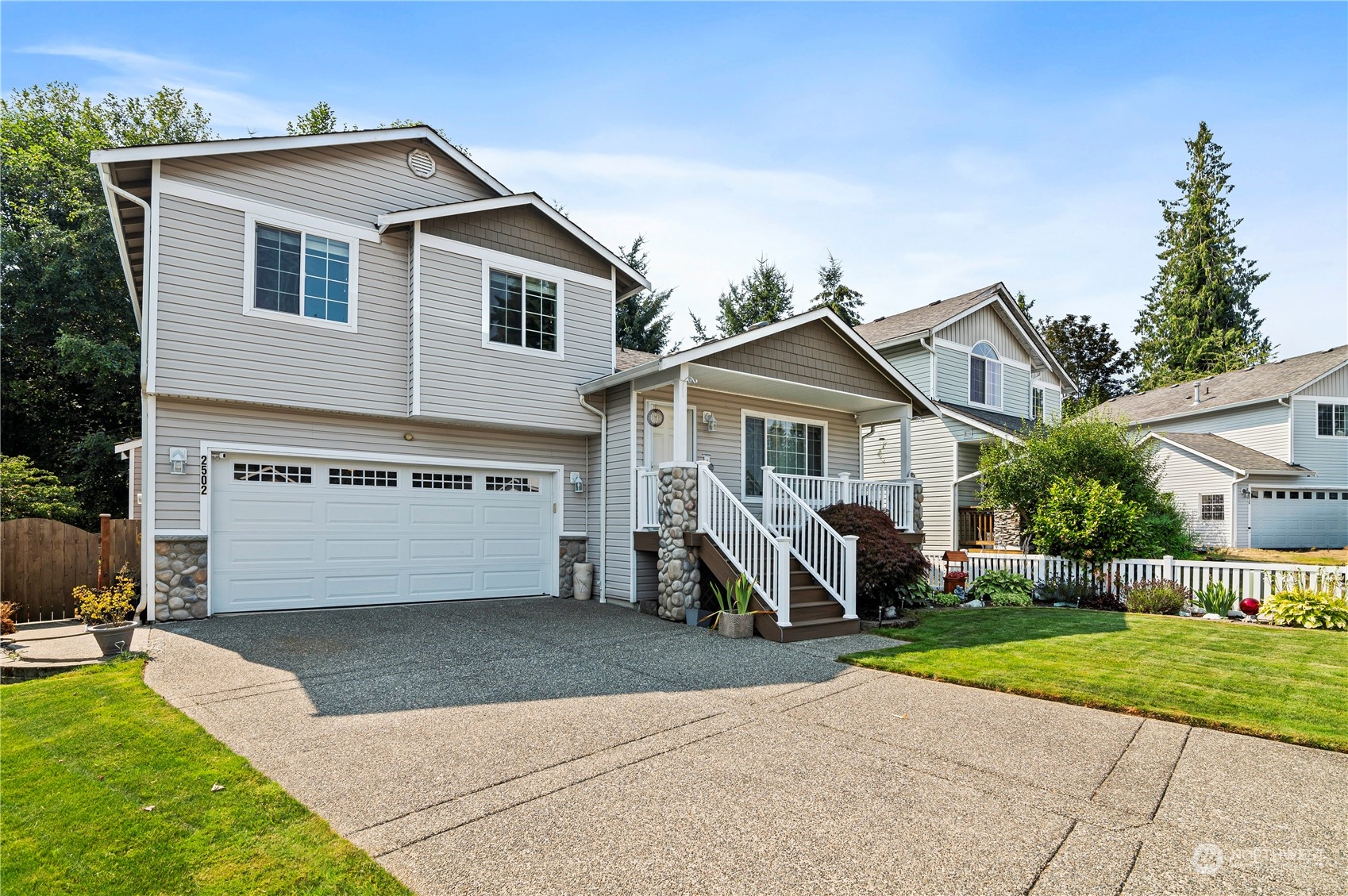 2502 97th Place Southeast Everett, WA 98208 - Photo 3 of 29 a front view of a house with a yard