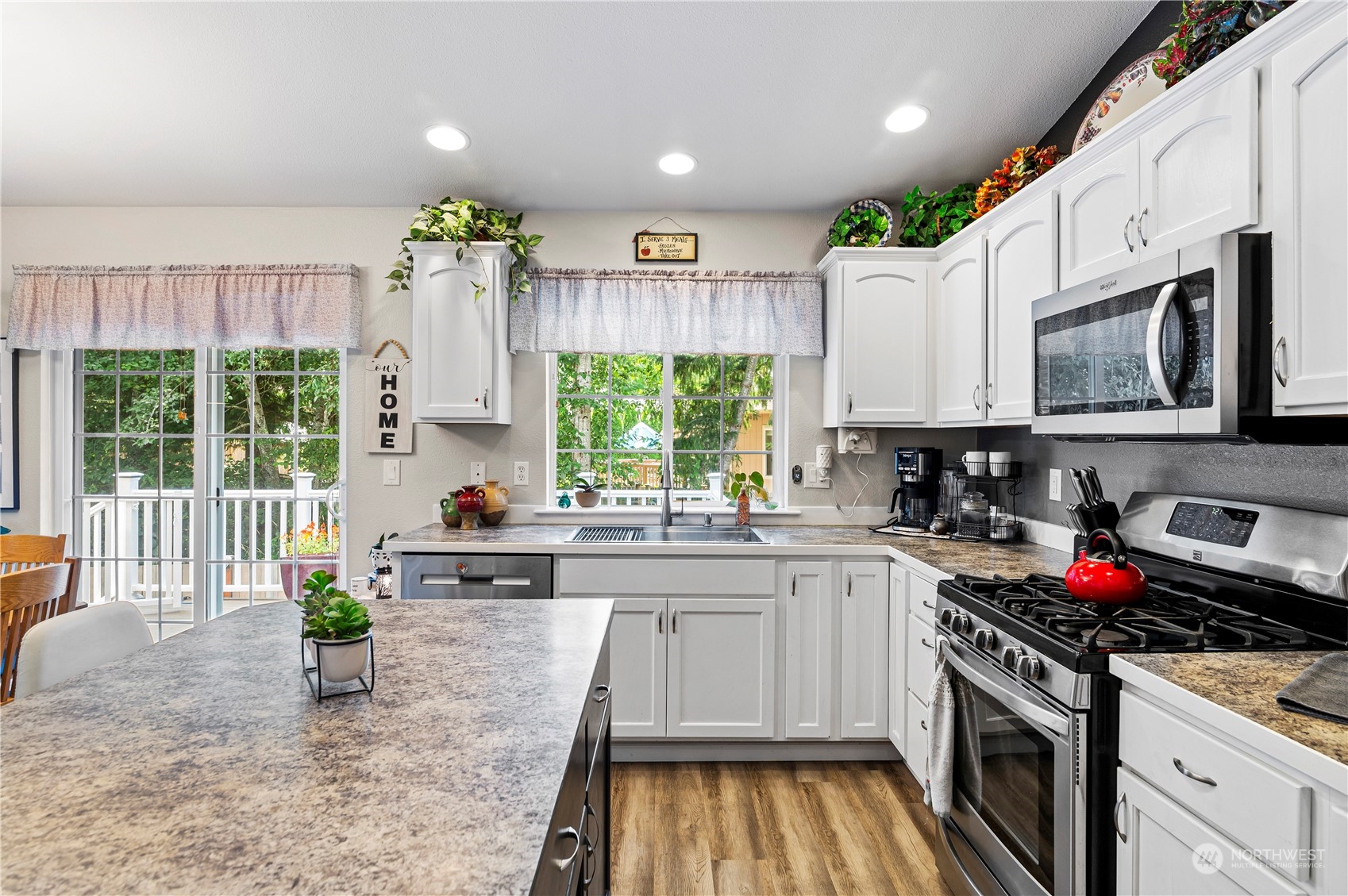 2502 97th Place Southeast Everett, WA 98208 - Photo 8 of 29 a kitchen with a stove a sink and a microwave