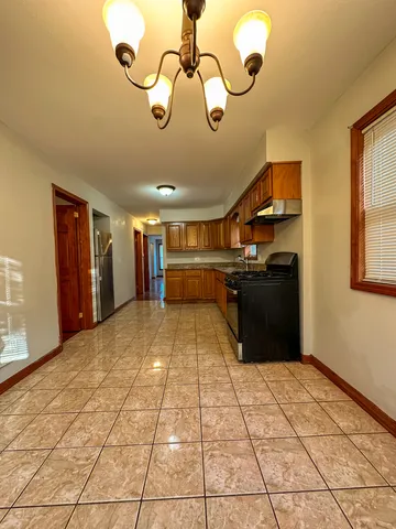 a room with lots of appliances and cabinets