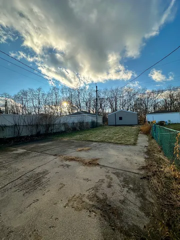 a view of a yard with a lake view