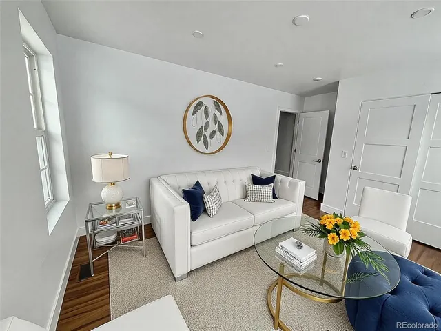 a living room with furniture and a table