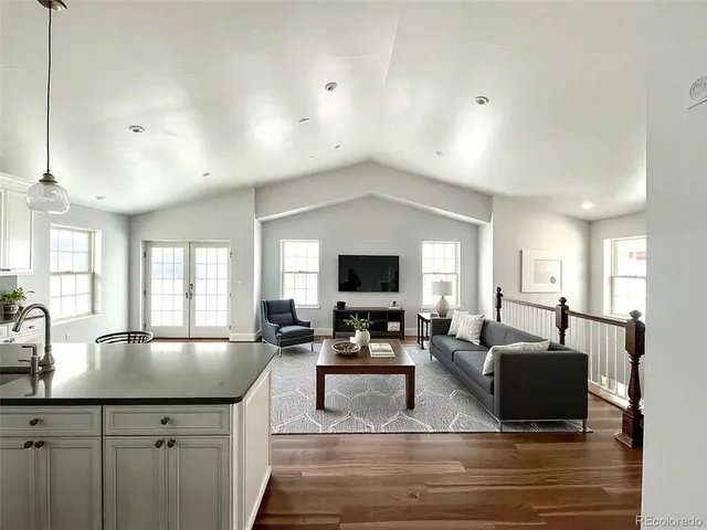 a large kitchen with lots of counter space and windows