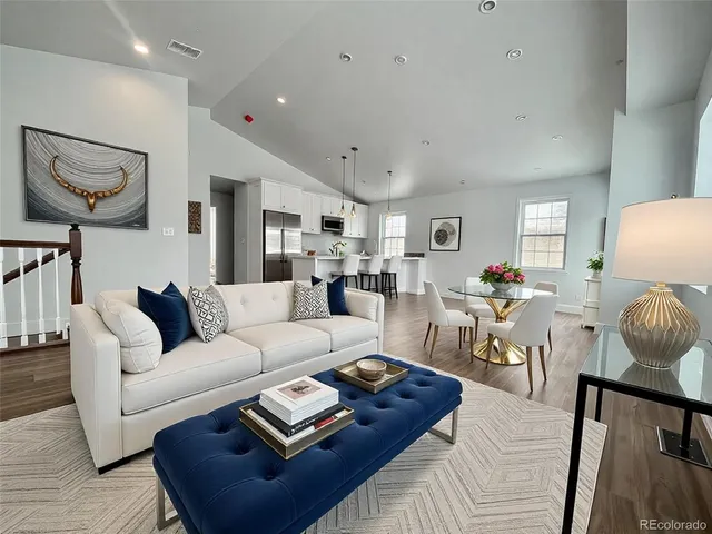 a living room with furniture and a table