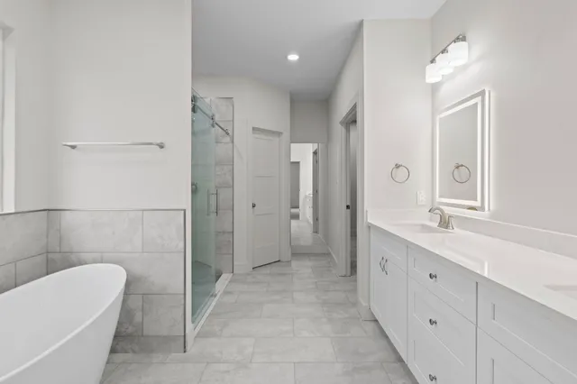a bathroom with double sink and a mirror