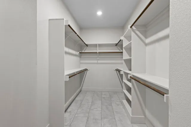 a view of an empty walk in closet