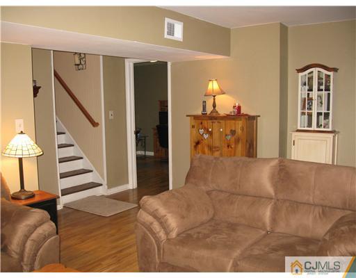 39 Warrenville Road Middlesex, NJ 08846 - Photo 12 of 23 a living room with furniture and wooden floor