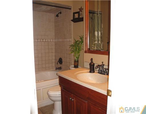 39 Warrenville Road Middlesex, NJ 08846 - Photo 18 of 23 a bathroom with a sink a toilet and shower