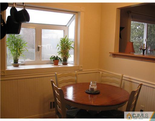39 Warrenville Road Middlesex, NJ 08846 - Photo 5 of 23 a view of a dining room with furniture and window