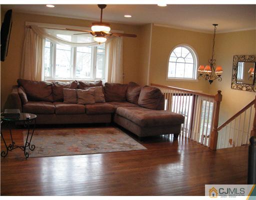 39 Warrenville Road Middlesex, NJ 08846 - Photo 7 of 23 a living room with furniture and a wooden floor