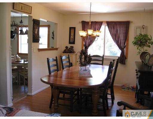 39 Warrenville Road Middlesex, NJ 08846 - Photo 8 of 23 a view of a dining room with furniture and chandelier
