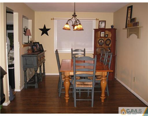 39 Warrenville Road Middlesex, NJ 08846 - Photo 9 of 23 a dining room with furniture and wooden floor