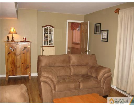 39 Warrenville Road Middlesex, NJ 08846 - Photo 10 of 23 a bedroom with a bed and a painting on the wall