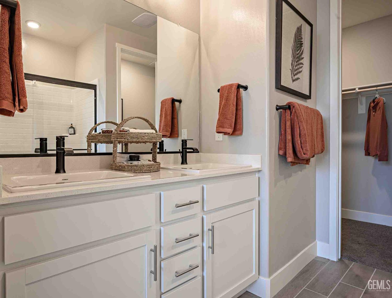 Undisclosed Address Bakersfield, CA 93313 - Photo 13 of 27 a bathroom with a sink and a mirror