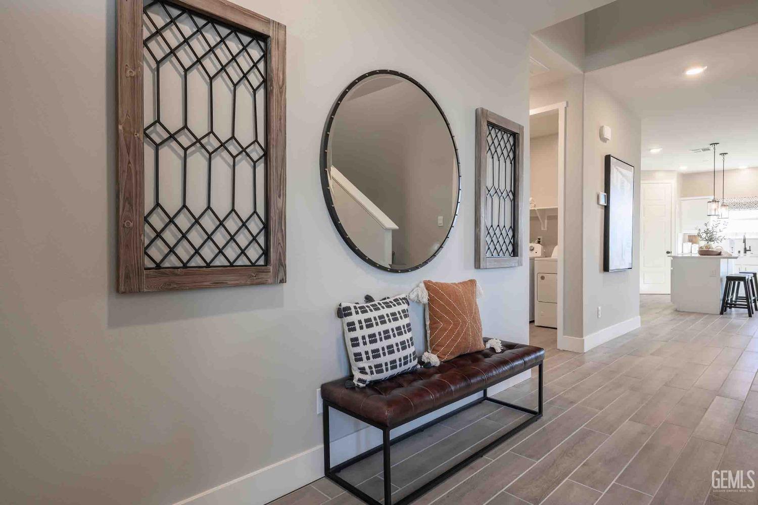 Undisclosed Address Bakersfield, CA 93313 - Photo 24 of 27 a view of a hallway with wooden floor and a potted plant