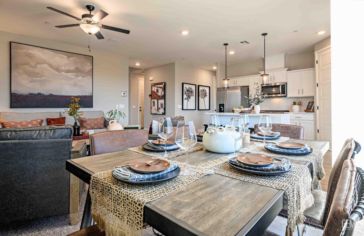 Undisclosed Address Bakersfield, CA 93313 - Photo 7 of 27 a kitchen with sink dining table and chairs