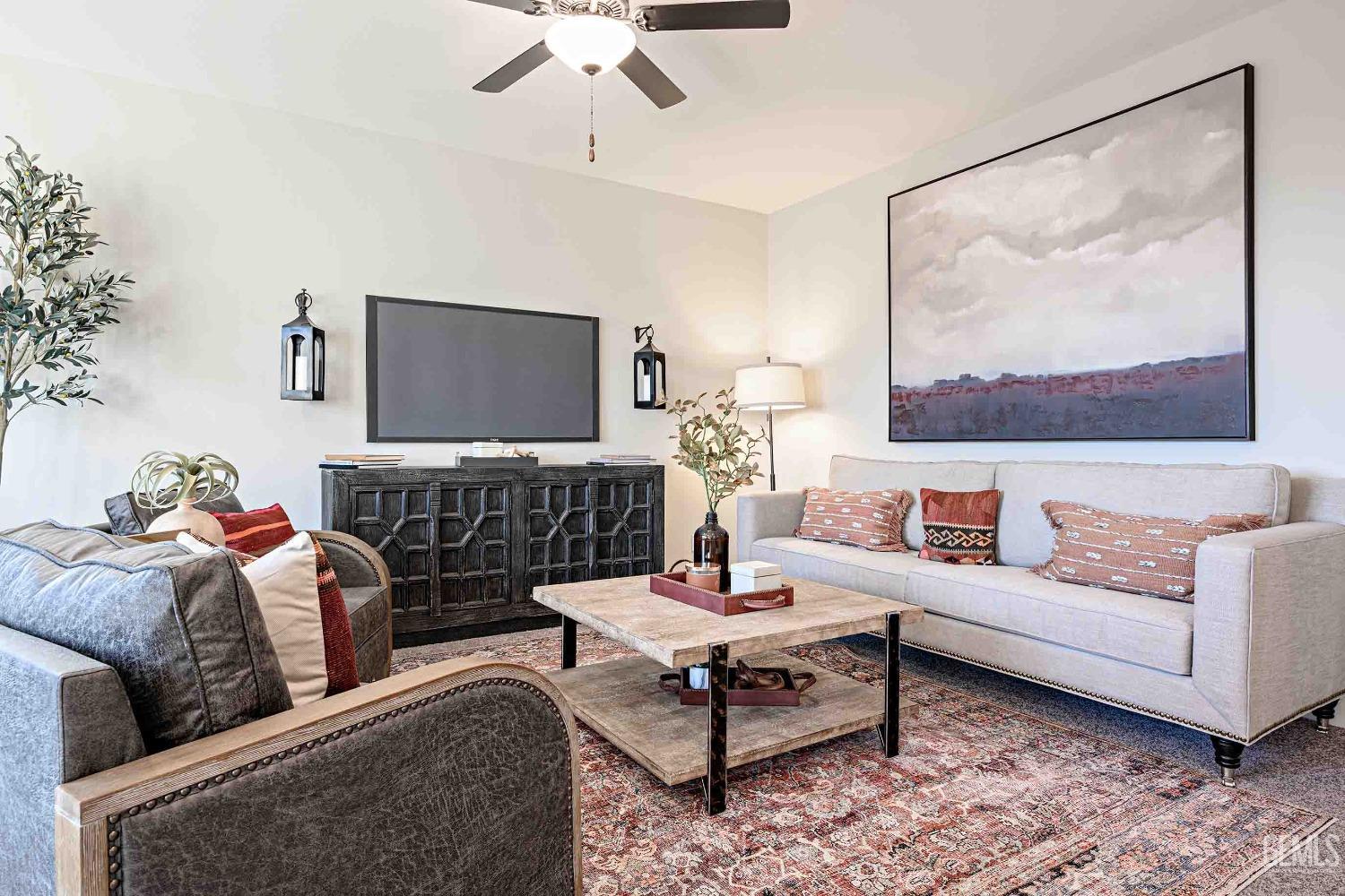 Undisclosed Address Bakersfield, CA 93313 - Photo 9 of 27 a living room with furniture and a flat screen tv