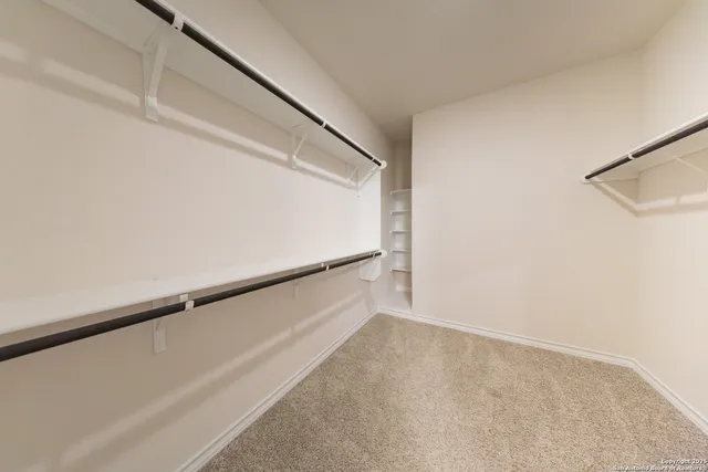 a view of an empty walk in closet