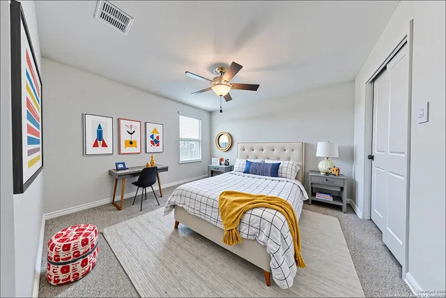 a bedroom with bed and window