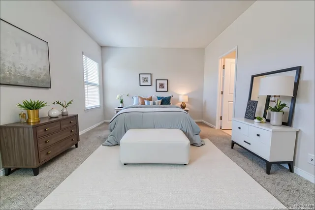 a bedroom with a bed and a couch