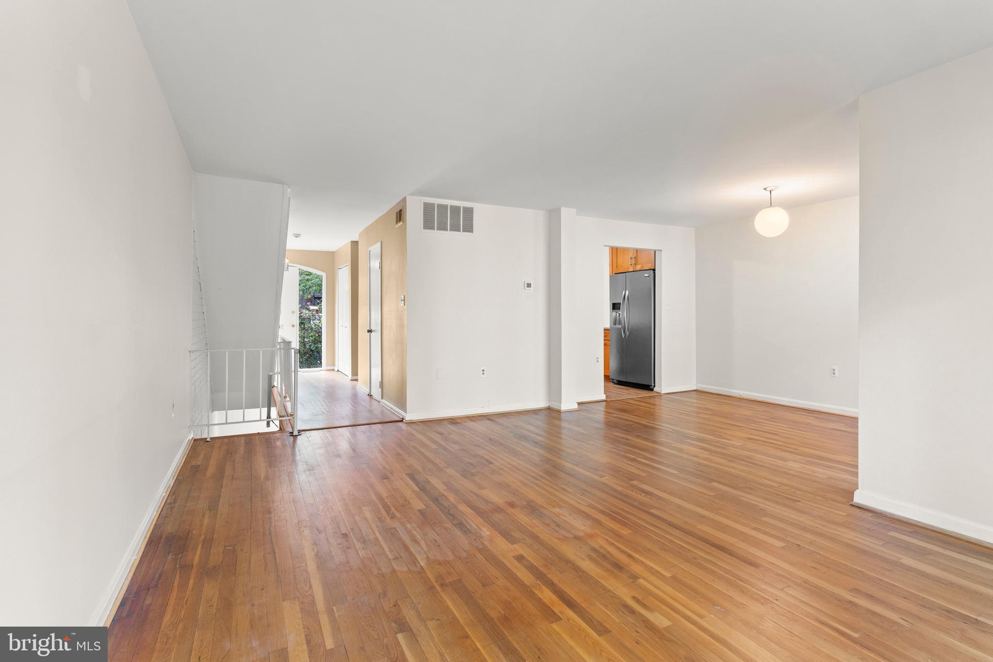 7911 Inverness Ridge Road Potomac, MD 20854 - Photo 15 of 45 a view of empty room with wooden floor and window