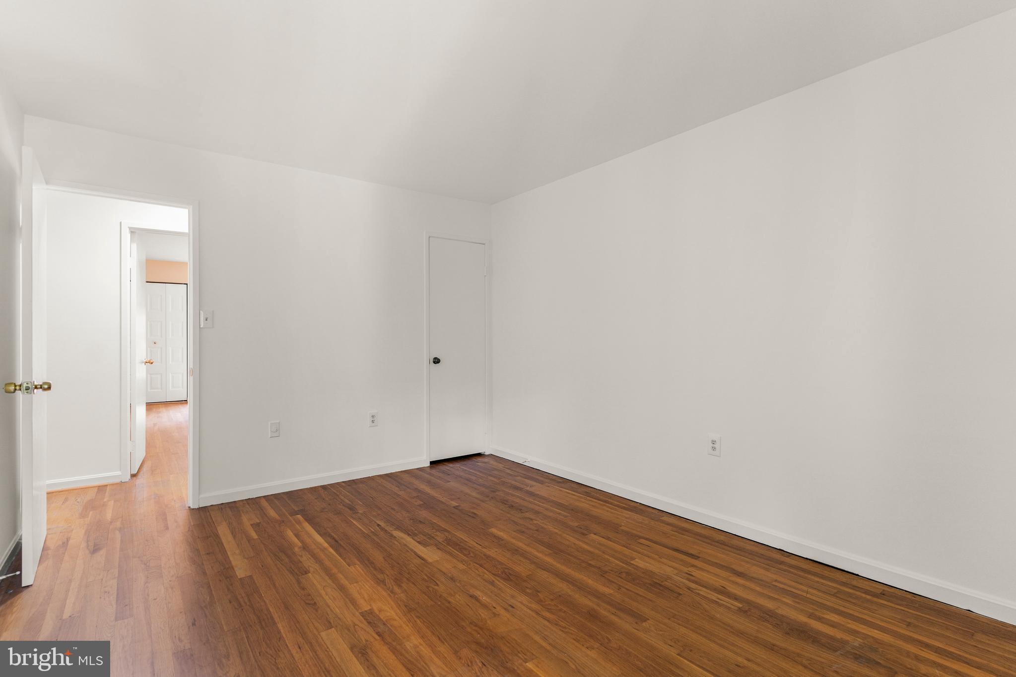 7911 Inverness Ridge Road Potomac, MD 20854 - Photo 16 of 45 a view of empty room with wooden floor