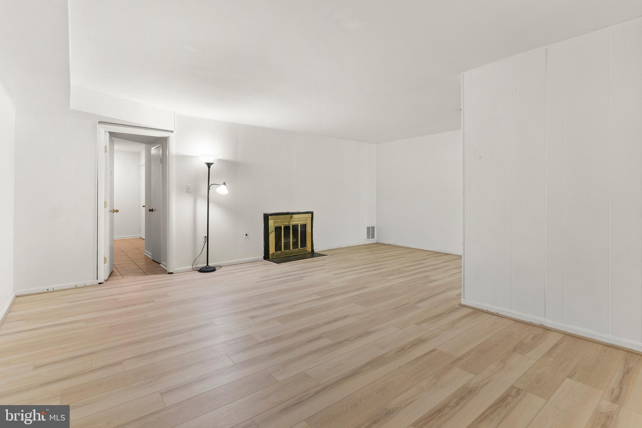 7911 Inverness Ridge Road Potomac, MD 20854 - Photo 20 of 45 a view of an empty room with wooden floor