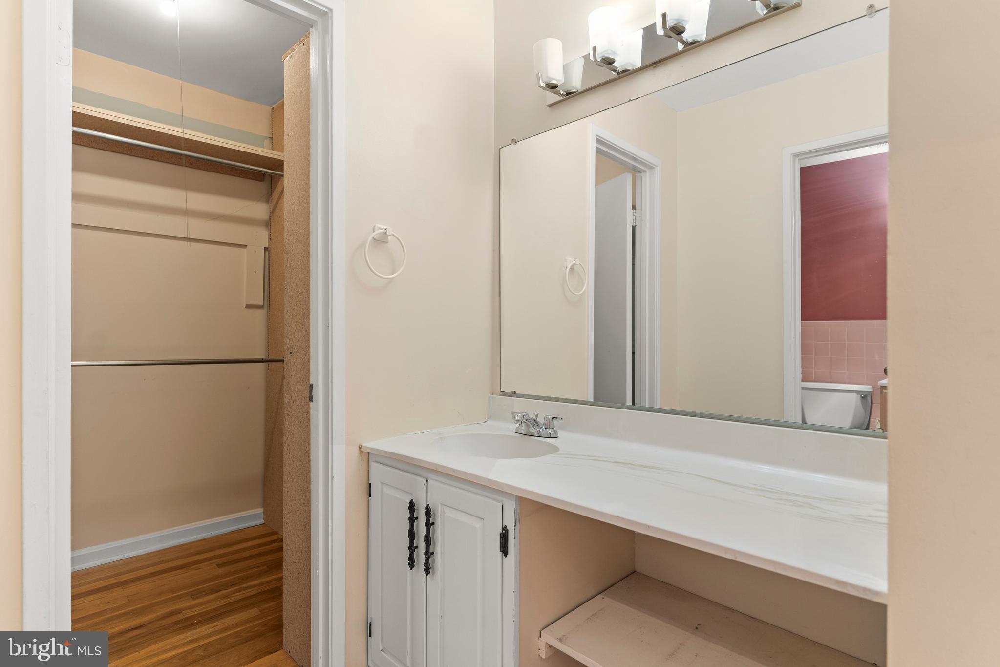 7911 Inverness Ridge Road Potomac, MD 20854 - Photo 28 of 45 a bathroom with a double vanity sink and a mirror