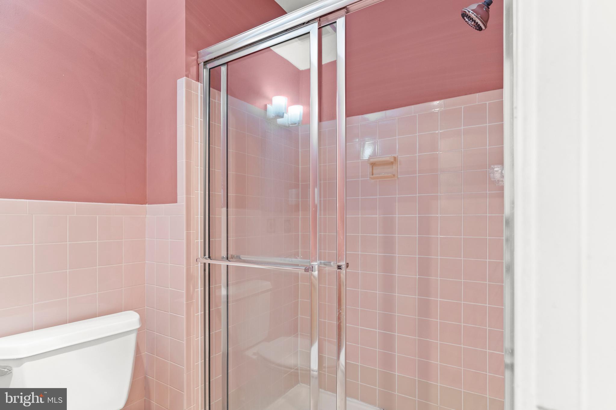 7911 Inverness Ridge Road Potomac, MD 20854 - Photo 30 of 45 a bathroom with a shower and a toilet