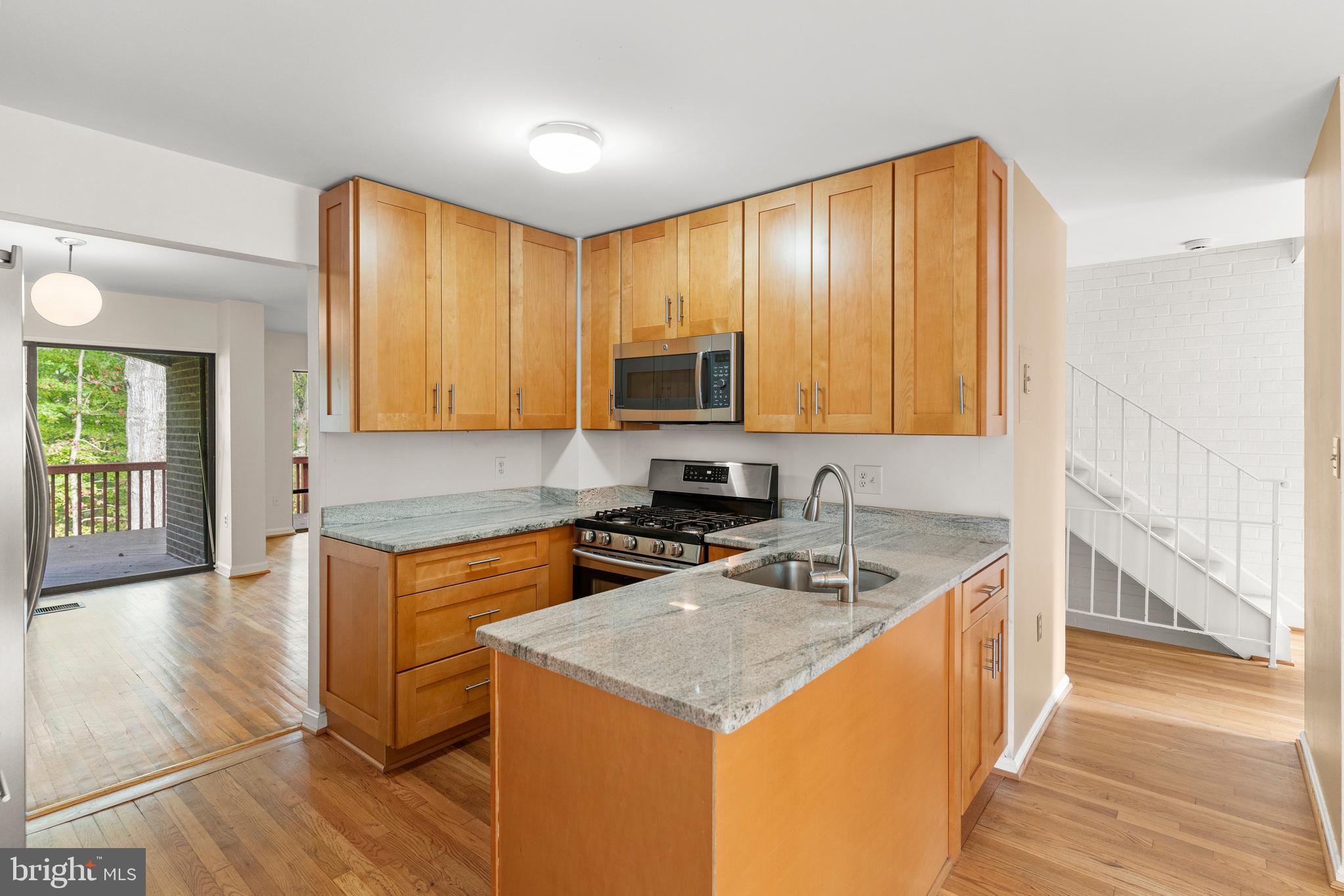 7911 Inverness Ridge Road Potomac, MD 20854 - Photo 3 of 45 a kitchen that has a sink and a stove in it