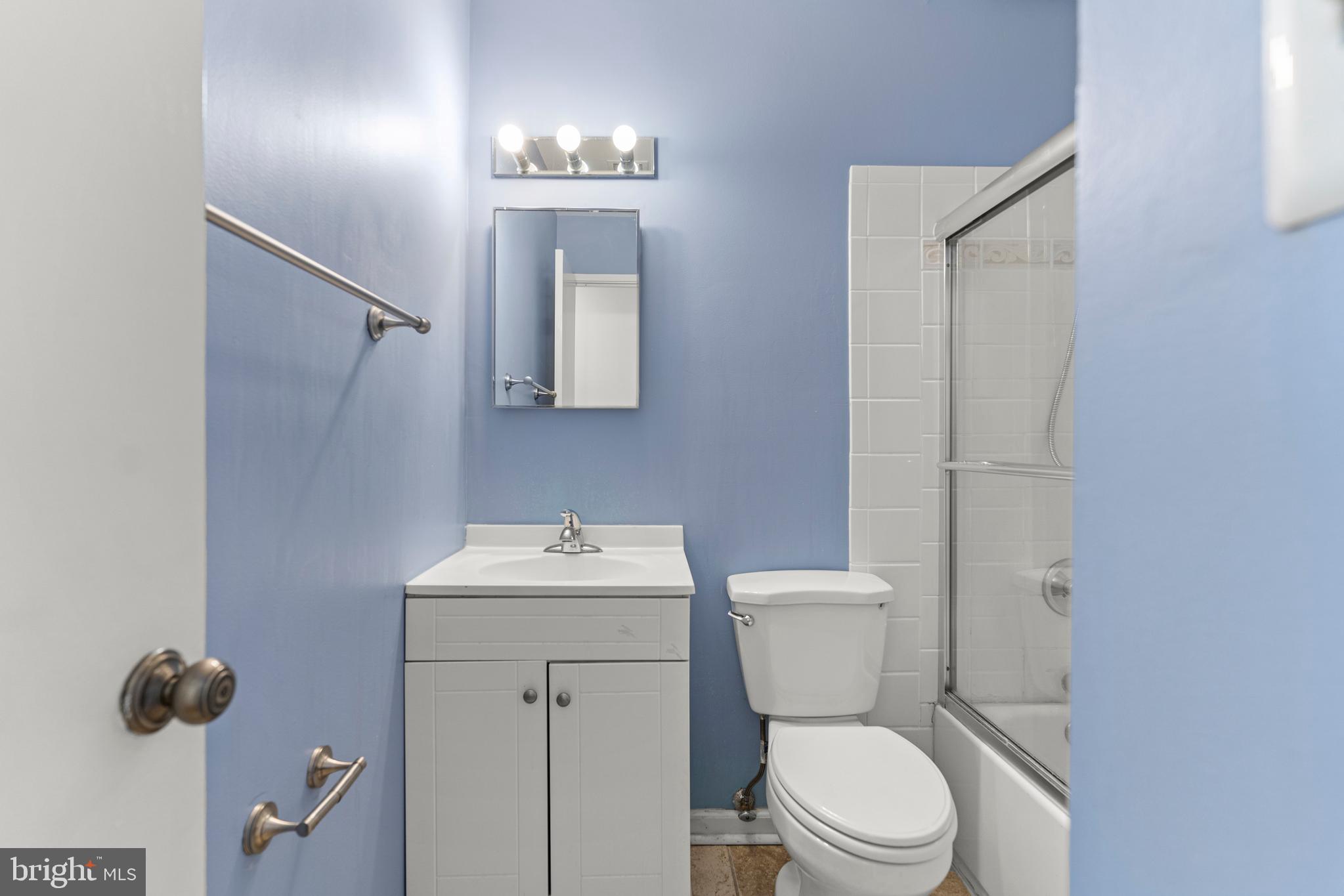7911 Inverness Ridge Road Potomac, MD 20854 - Photo 32 of 45 a bathroom with a toilet sink and mirror