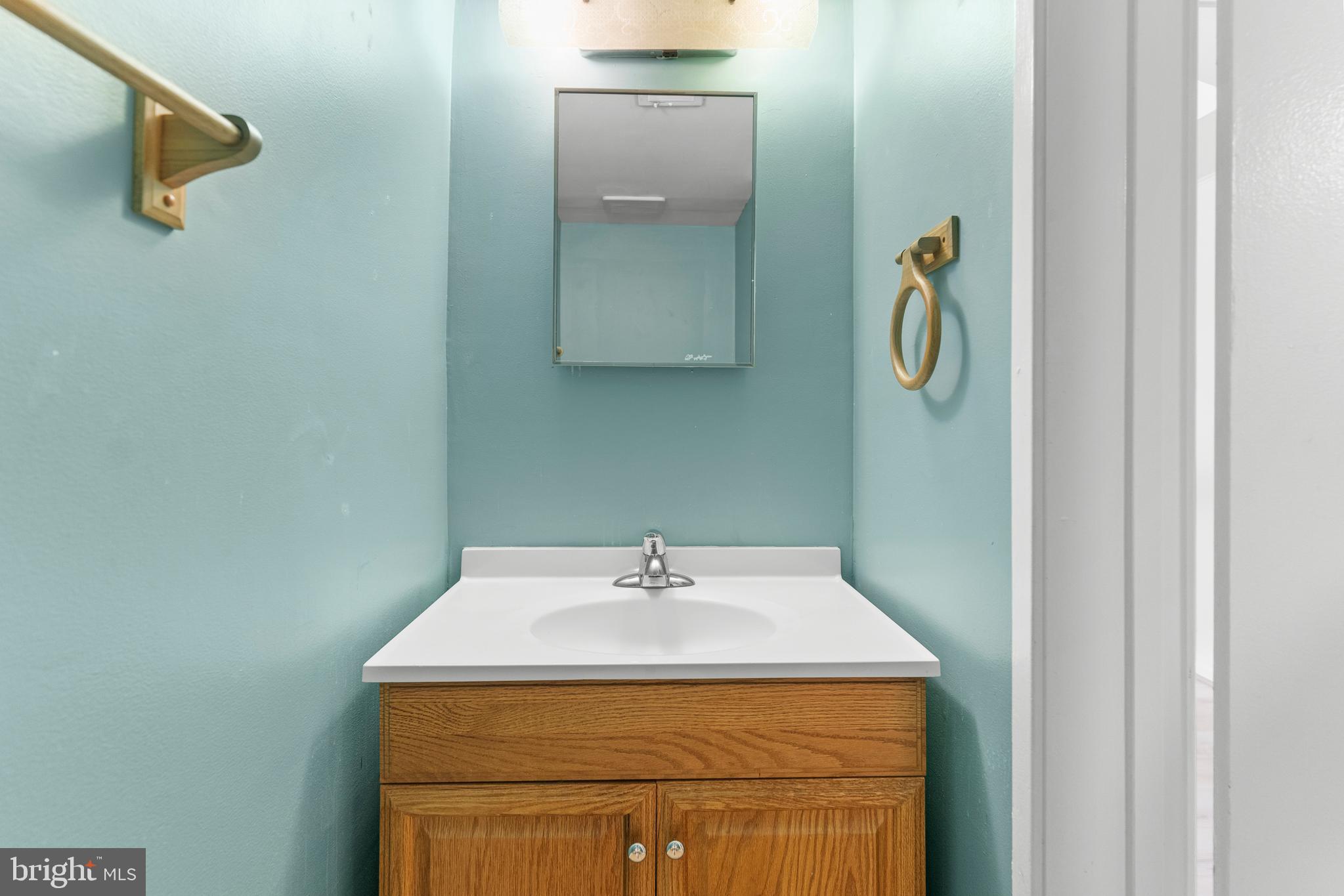 7911 Inverness Ridge Road Potomac, MD 20854 - Photo 34 of 45 a utility room with a sink and mirror
