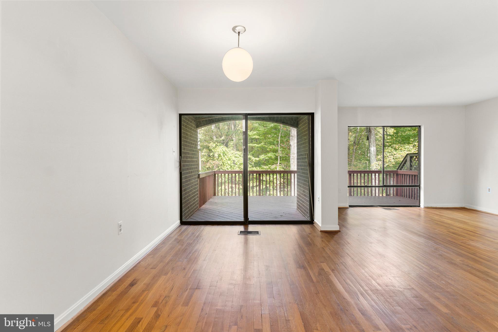 7911 Inverness Ridge Road Potomac, MD 20854 - Photo 35 of 45 wooden floor in an empty room with a window