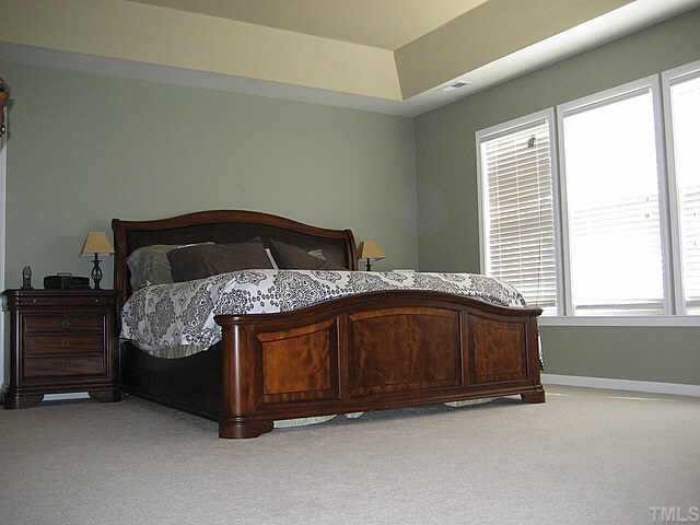 7552 Silver View Lane Raleigh, NC 27613 - Photo 6 of 10 a bedroom with a bed and a window