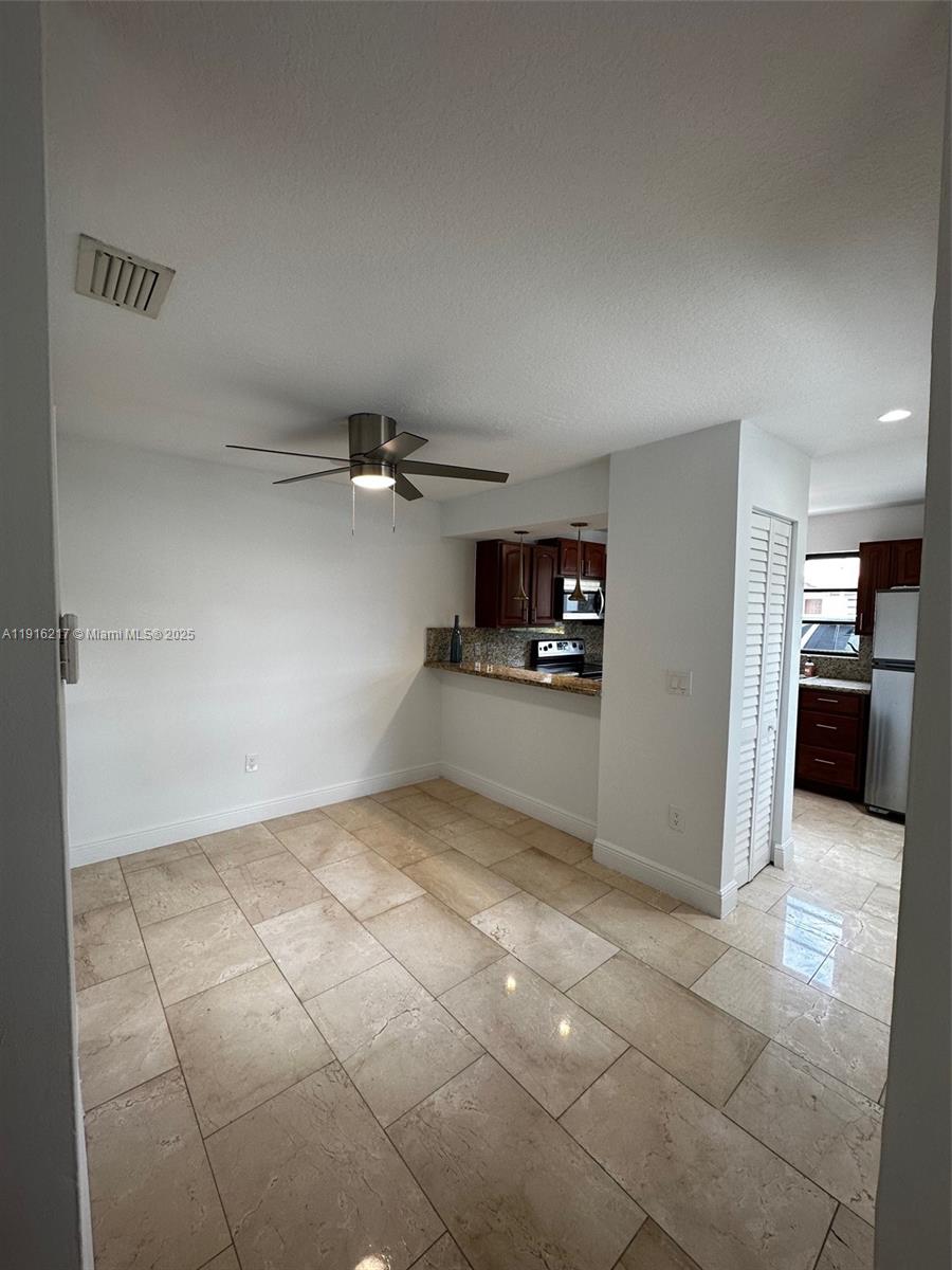13440 Southwest 62nd Street, Unit G101 Miami, FL 33183 - Photo 7 of 21 a view of a kitchen with a sink