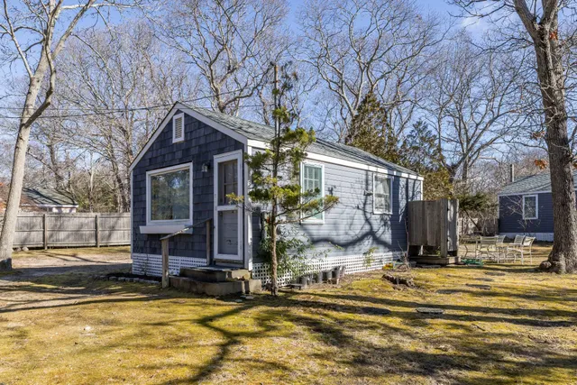 a view of a house with snow on the side of it