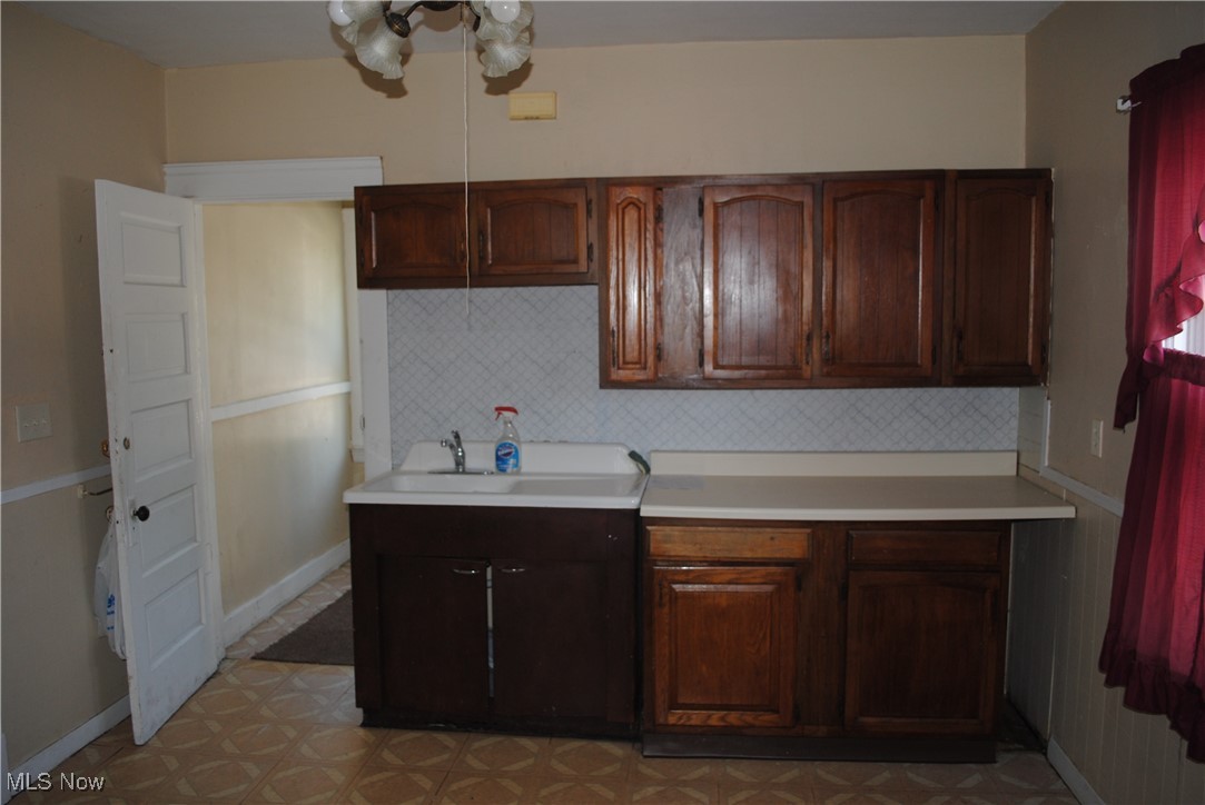 841 Whitcomb Road Cleveland, OH 44110 - Photo 26 of 30 Kitchen with light countertops and tasteful backsplash